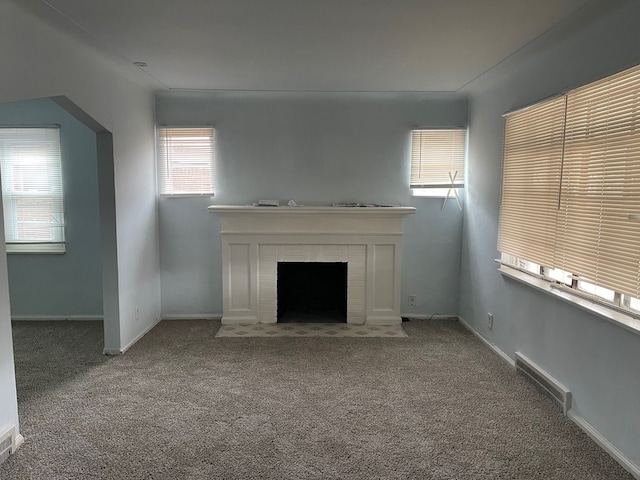 unfurnished living room with carpet floors