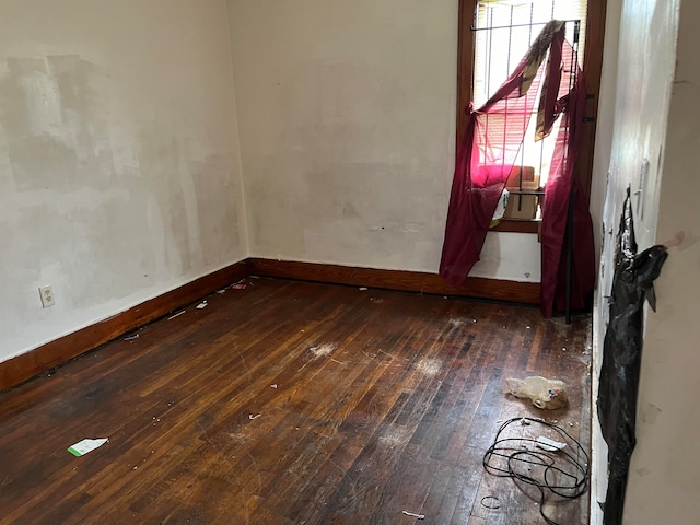 empty room featuring dark hardwood / wood-style flooring