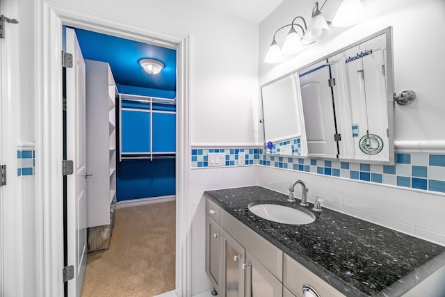 bathroom featuring tasteful backsplash and vanity