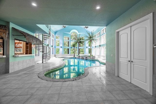 view of swimming pool with ceiling fan