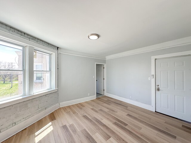 3737 Scovel Pl, Detroit, MI 48208 - unfurnished room with light wood-type flooring, baseboards, and ornamental molding