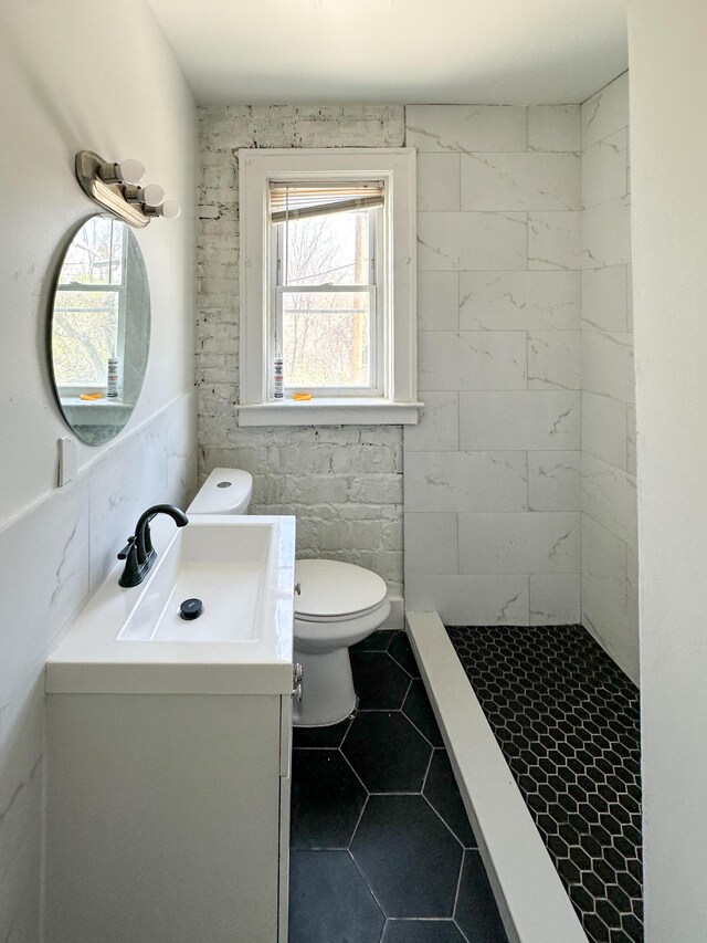 3737 Scovel Pl, Detroit, MI 48208 - full bathroom with vanity, toilet, tile patterned flooring, and a tile shower