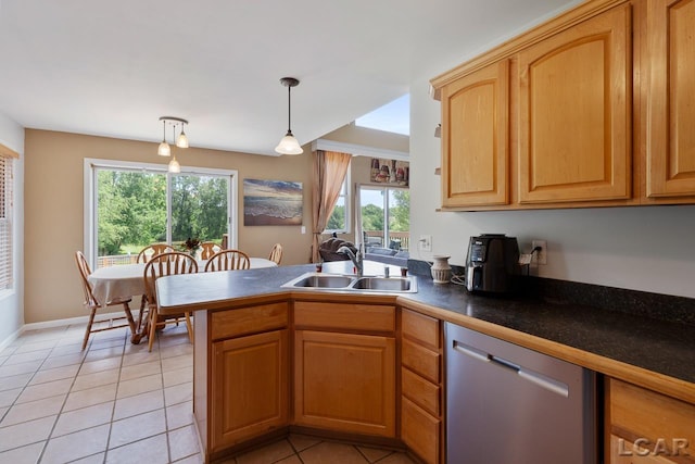 kitchen featuring sink, stainless steel dishwasher, kitchen peninsula, pendant lighting, and light tile patterned flooring