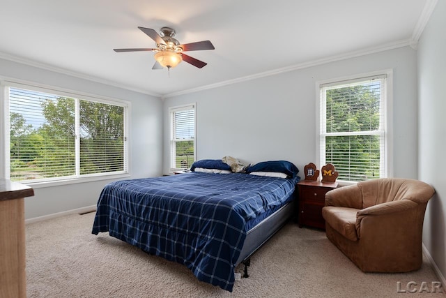 bedroom featuring multiple windows, ceiling fan, carpet, and ornamental molding