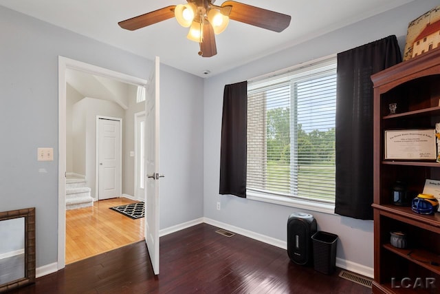 interior space featuring dark hardwood / wood-style floors and ceiling fan