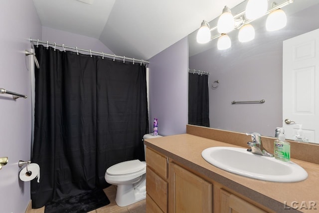 bathroom featuring tile patterned floors, vanity, vaulted ceiling, and toilet