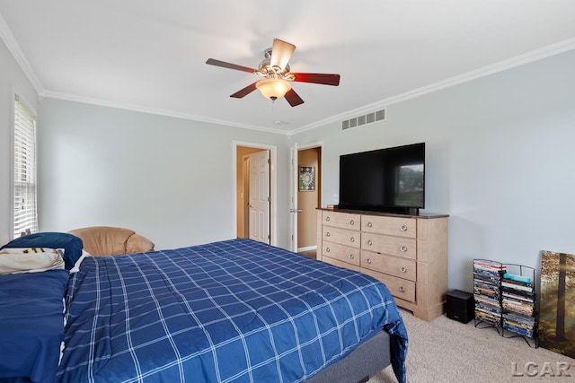 bedroom with carpet, ceiling fan, and crown molding