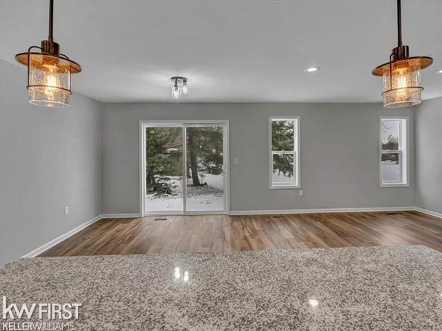 unfurnished living room featuring hardwood / wood-style floors