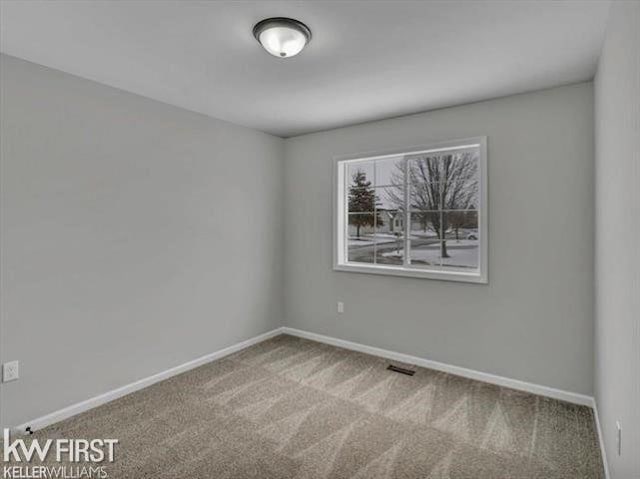 unfurnished room with carpet floors