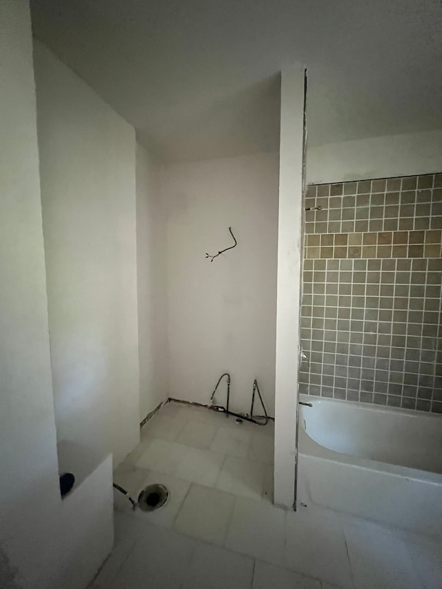 bathroom featuring tile patterned flooring and a bathing tub