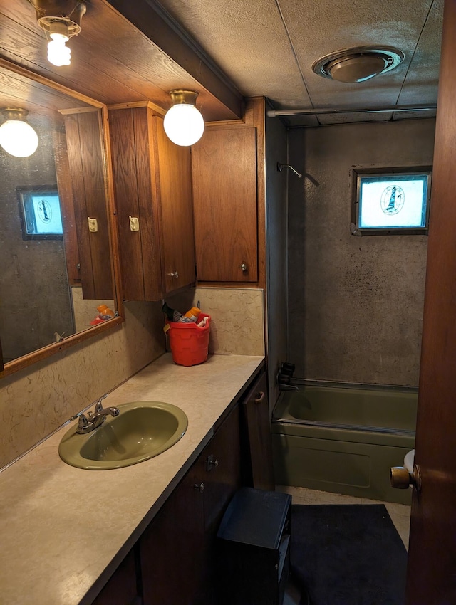 bathroom featuring vanity and shower / bath combination