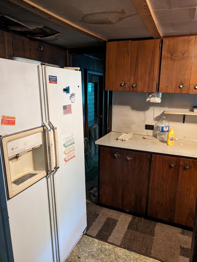 kitchen with white fridge with ice dispenser