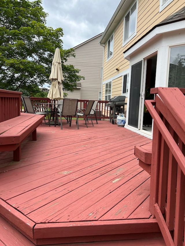 wooden terrace featuring grilling area