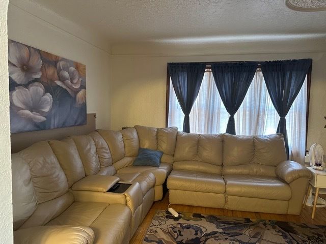 living room featuring a textured ceiling