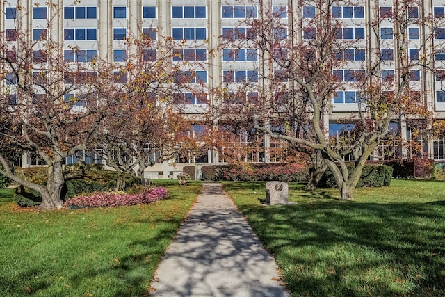 view of home's community featuring a lawn