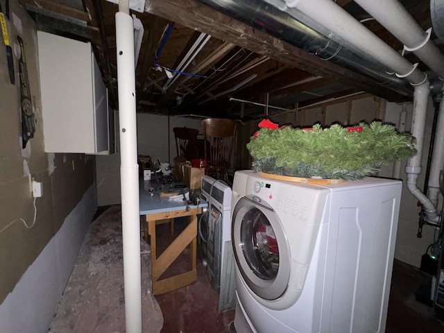 laundry room with washer / dryer