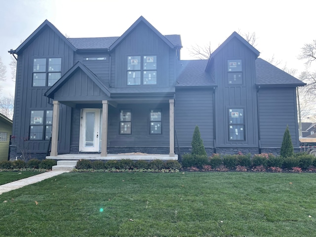 modern farmhouse featuring a front lawn