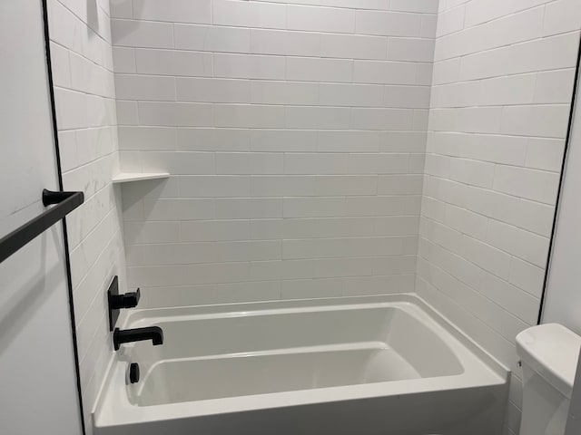 bathroom with shower / bathtub combination and toilet