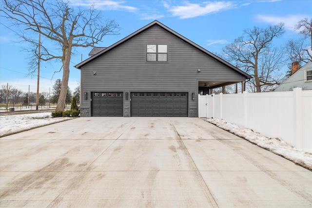 view of side of home with a garage