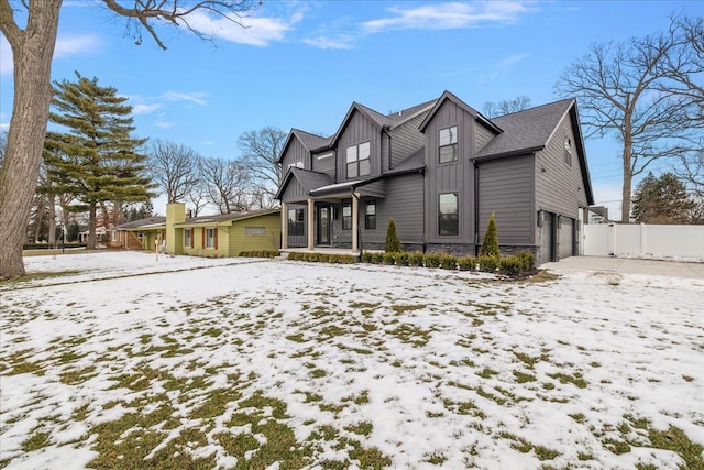 exterior space with a garage and covered porch