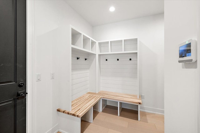 mudroom with light hardwood / wood-style floors