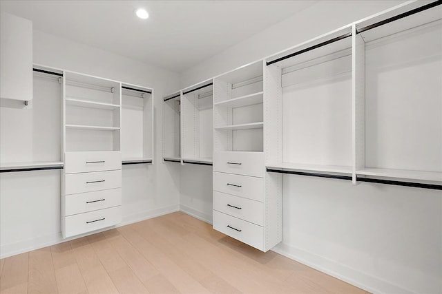 spacious closet with light hardwood / wood-style floors