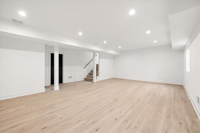 basement featuring light hardwood / wood-style flooring