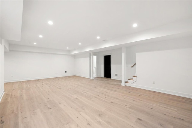 basement featuring light hardwood / wood-style flooring