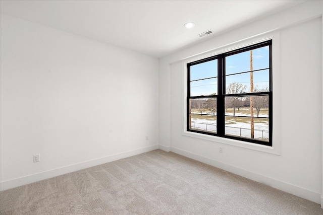 empty room featuring light colored carpet