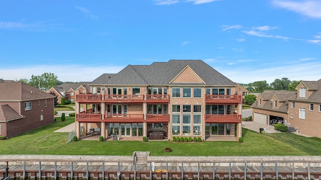 18 Sand Bar Ln, Detroit, MI 48214 - rear view of house featuring a lawn, a residential view, a patio, and a wooden deck