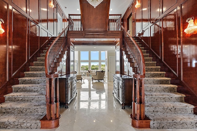 18 Sand Bar Ln, Detroit, MI 48214 - stairway featuring tile patterned floors and a towering ceiling