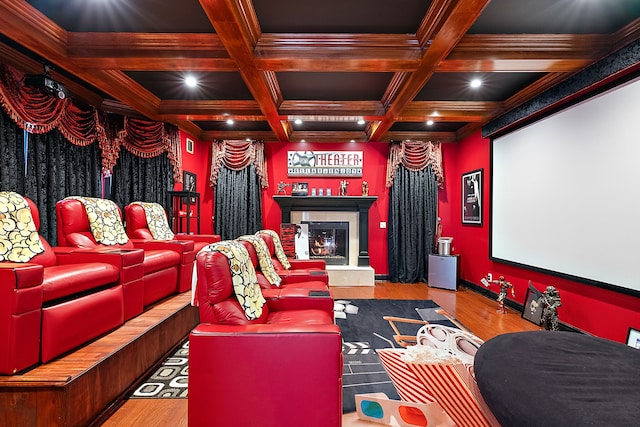 home theater room with beam ceiling, coffered ceiling, and ornamental molding