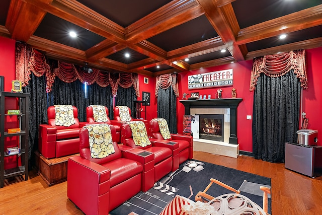 home theater room with hardwood / wood-style flooring, beamed ceiling, and coffered ceiling