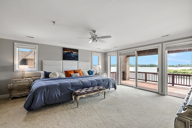 bedroom featuring ceiling fan, access to exterior, and multiple windows