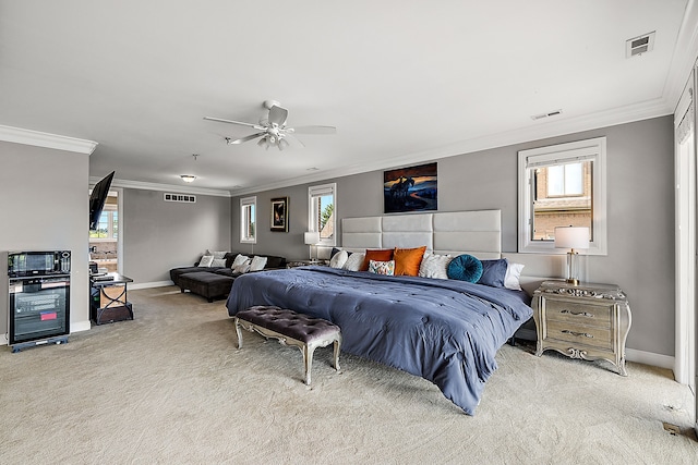 bedroom with multiple windows, ceiling fan, and crown molding