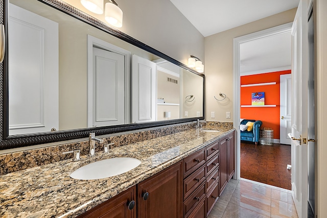 bathroom featuring vanity, hardwood / wood-style flooring, and ornamental molding