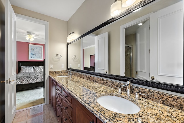 bathroom featuring ceiling fan, crown molding, and vanity