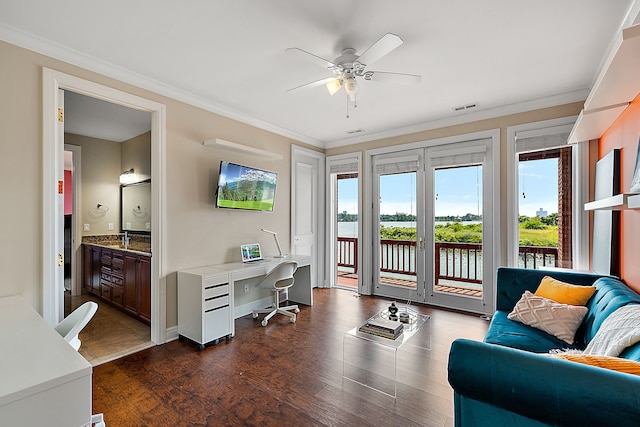 home office with dark hardwood / wood-style floors, ceiling fan, and crown molding