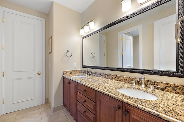 bathroom with tile patterned flooring and vanity