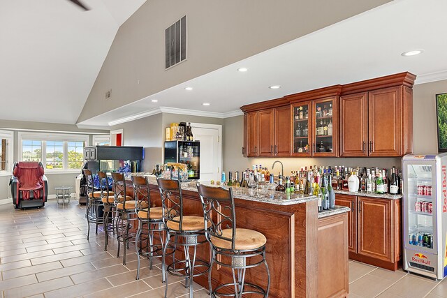 18 Sand Bar Ln, Detroit, MI 48214 - indoor wet bar with recessed lighting, crown molding, light tile patterned floors, and high vaulted ceiling