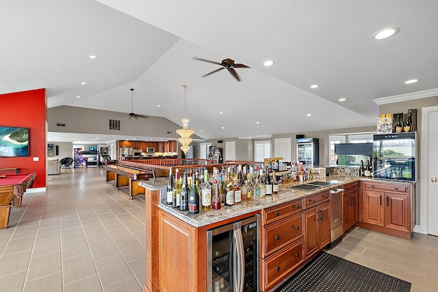 kitchen with lofted ceiling, billiards, ceiling fan, light stone countertops, and beverage cooler