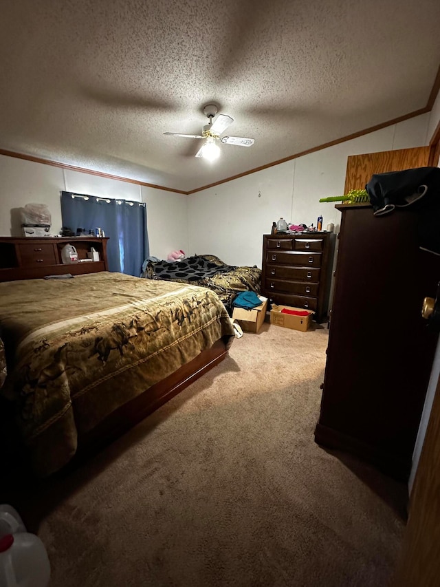 bedroom with carpet flooring, ceiling fan, crown molding, and a textured ceiling