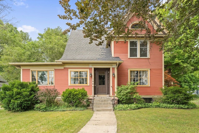 view of front of property with a front lawn