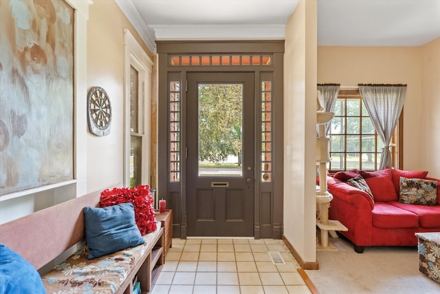 foyer featuring light carpet and a wealth of natural light