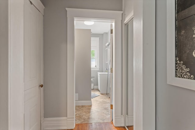 corridor featuring light hardwood / wood-style flooring