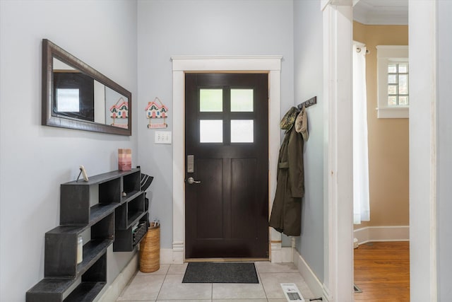 foyer featuring a wealth of natural light and light hardwood / wood-style floors