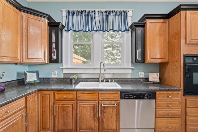 kitchen featuring stainless steel dishwasher, black oven, and sink