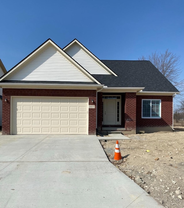 31608 Beaver Cir, New Boston, MI 48164 - view of front of house with brick siding, concrete driveway, an attached garage, and a shingled roof