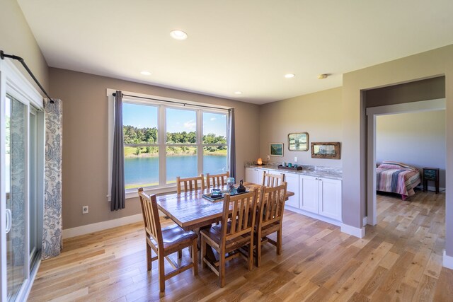 829 N Van Dyke Rd, Imlay City, MI 48444 - dining space with light wood finished floors, baseboards, recessed lighting, and a water view