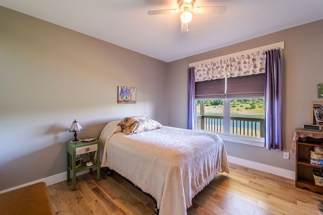 bedroom featuring hardwood / wood-style flooring and ceiling fan